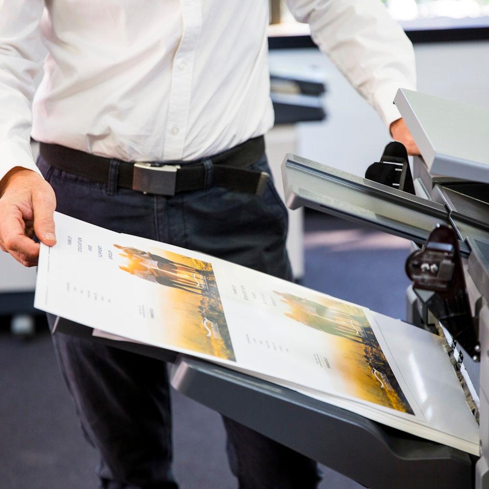 A&O professional print specialist reviewing a flyer printing service.